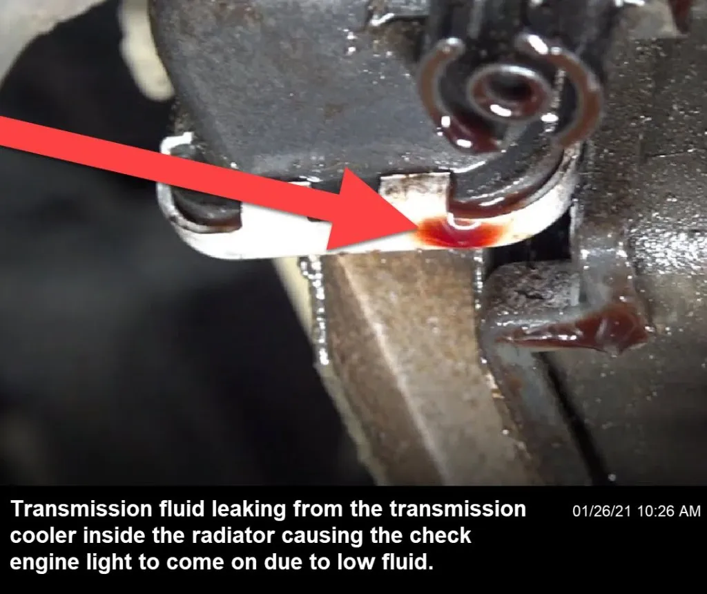 The check engine light is popping up because of a transmission fluid leak around the transmission cooler